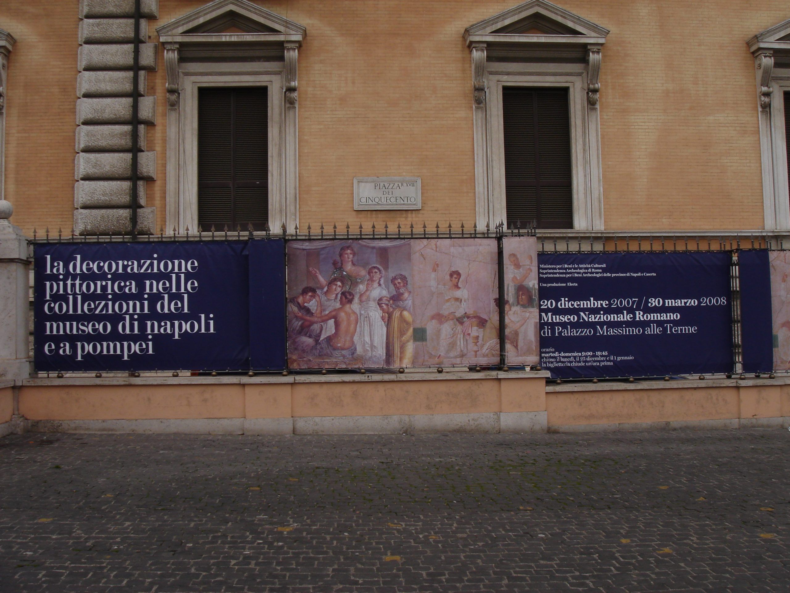 Banners outside the Museo Nazionale Romano at Palazzo Massimo alle Terme advertising a 2007–2008 exhibition on wall paintings from the collections of Naples and Pompeii.