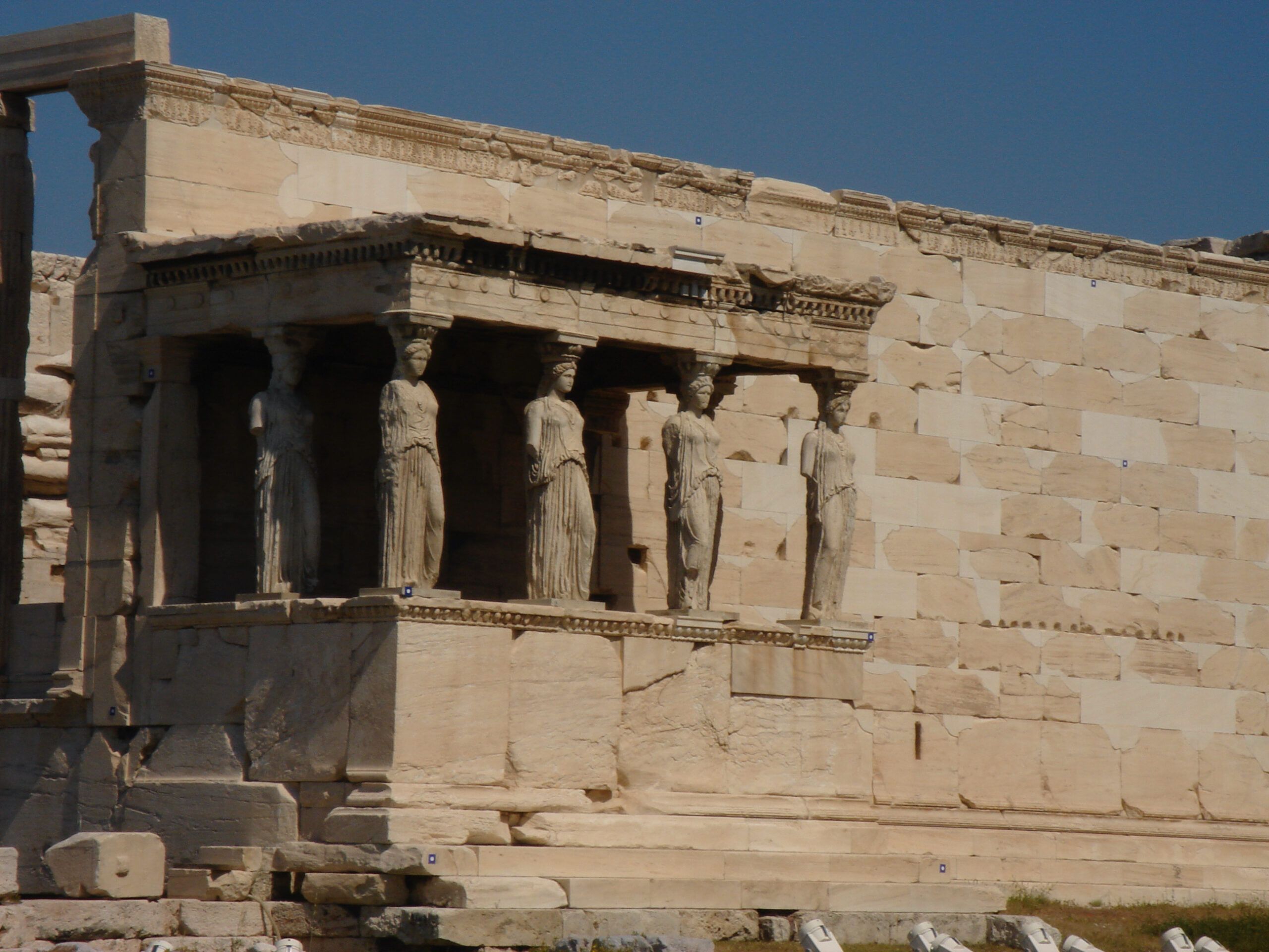 Close-up of the Porch of the Caryatids on the Erechtheion, showing six draped female statues supporting the roof.