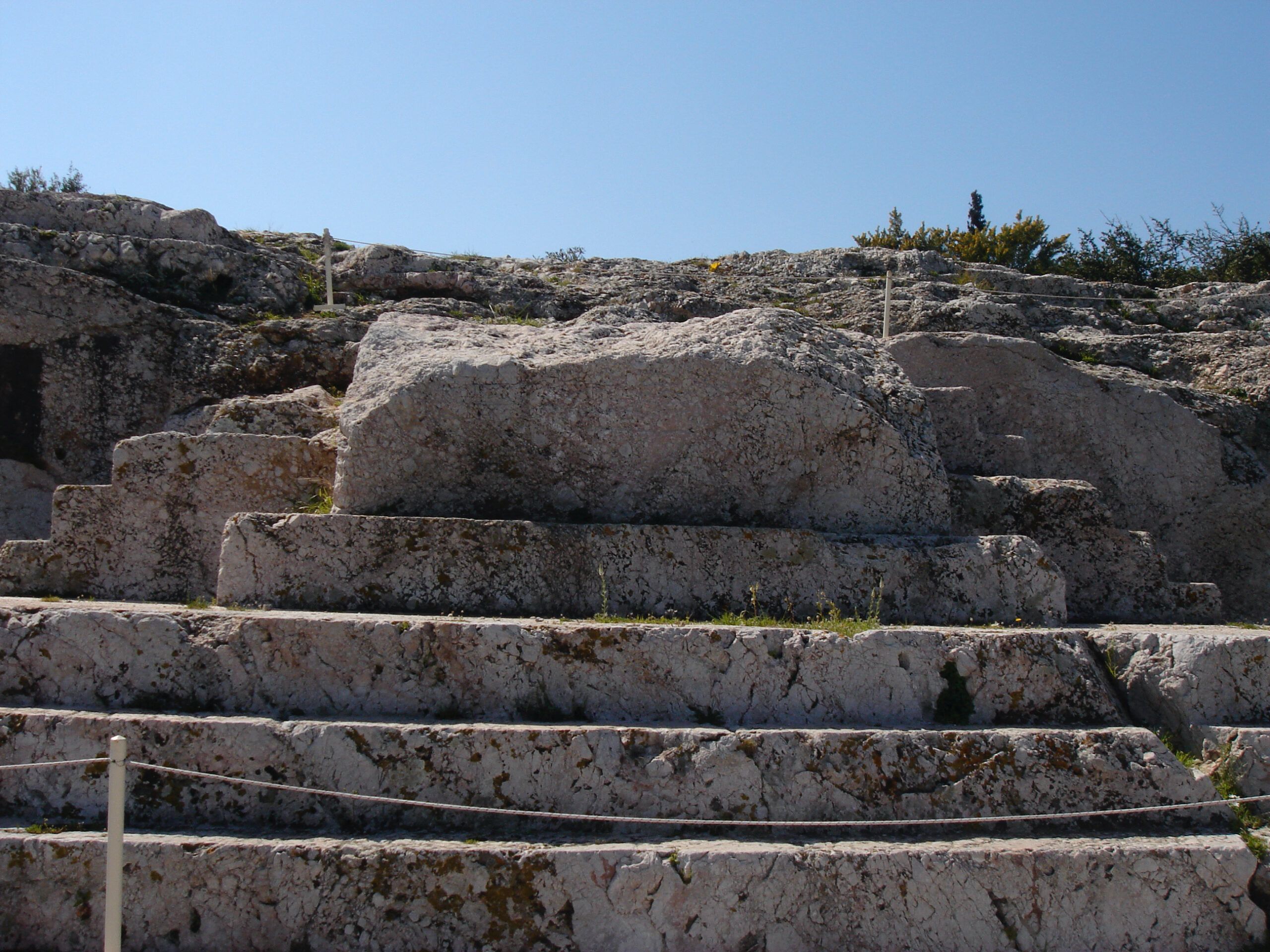 View through the columns of the Temple of Athena Nike on the Acropolis, showing scaffolding inside the ancient doorway.