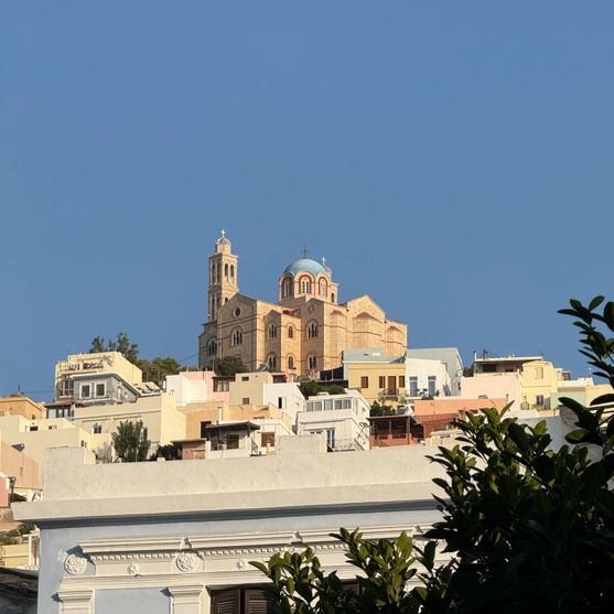Atop a hill full of colourful buildings sits the Church of the Resurrection of the Saviour, a neo-Classical Orthodox church.