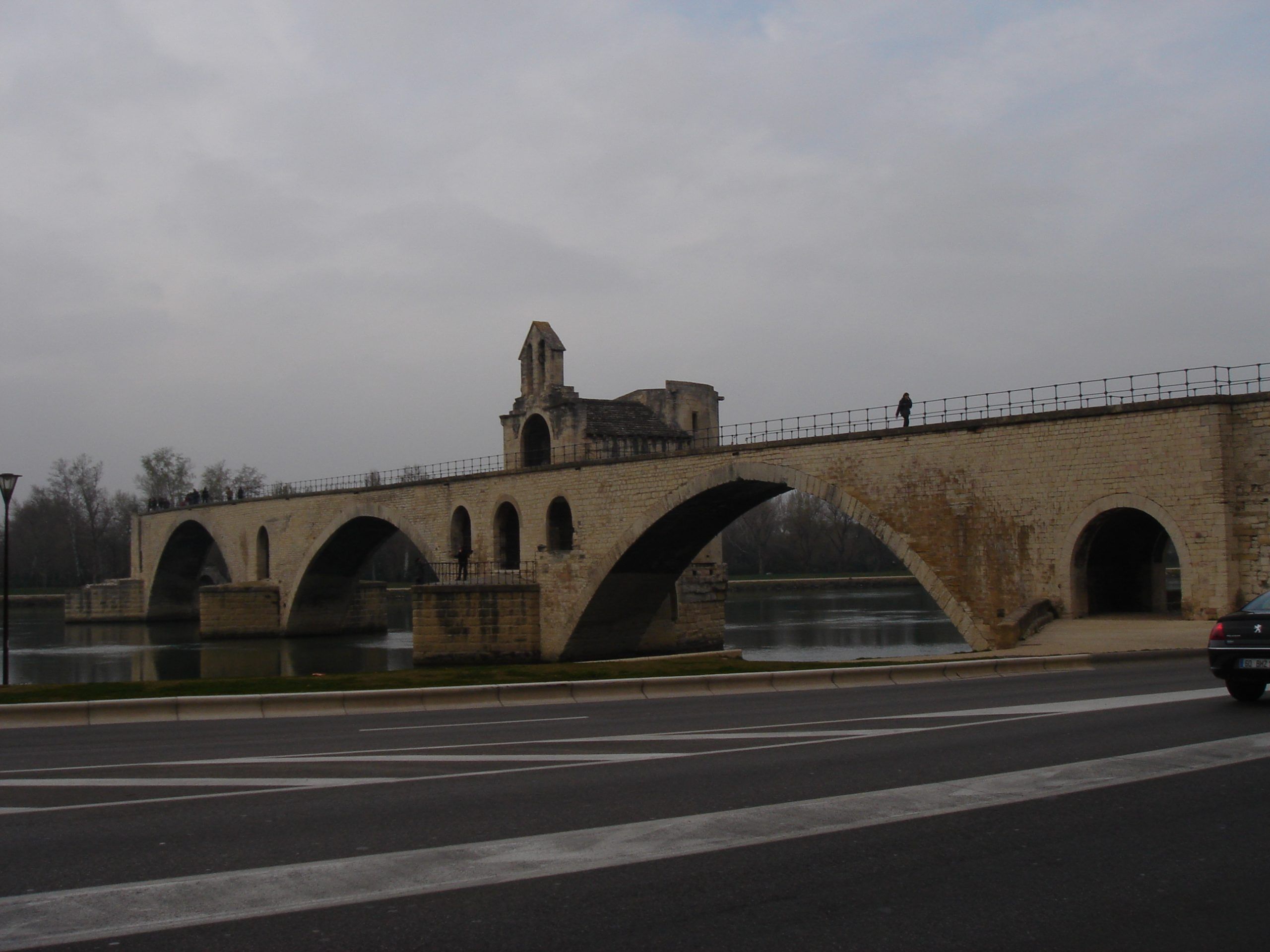 The Pont Saint-Bénézet in Avignon, seen from below with its distinctive arches spanning the Rhône River.