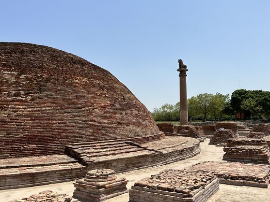 Brick stupa with Ashokan pillar topped by a lion capital at the ancient Buddhist site of Vaishali.