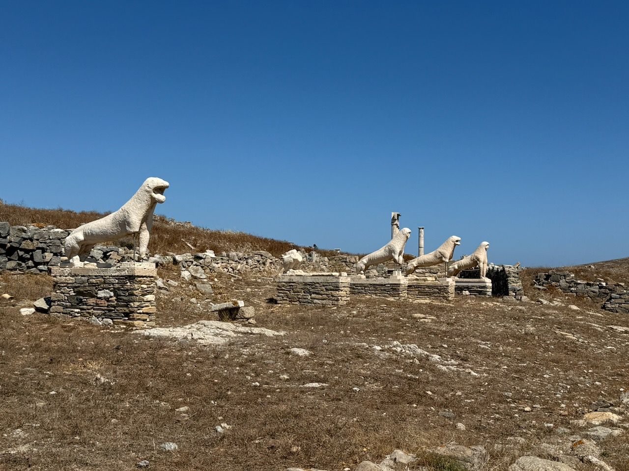 Four lion statues arrayed along the side of the terrace of the lions.