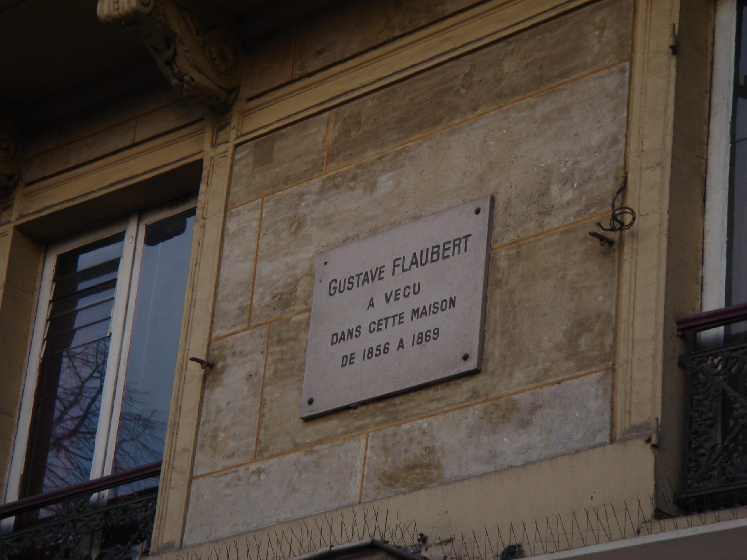 Wall plaque in French marking where Gustave Flaubert lived from 1856 to 1869.