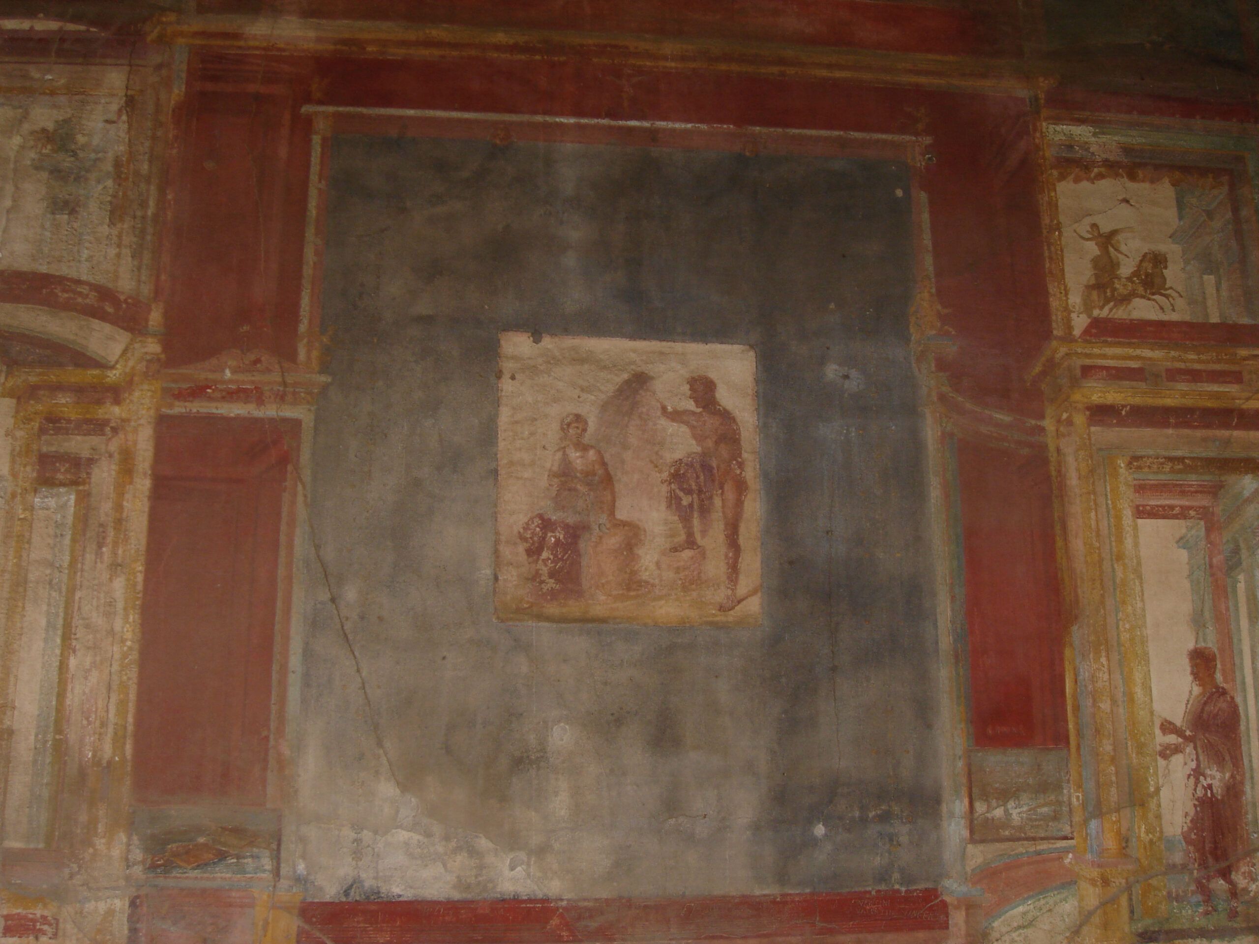 Fresco from the Macellum of Pompeii showing figures in a Roman domestic setting, framed by rich red and black painted panels.