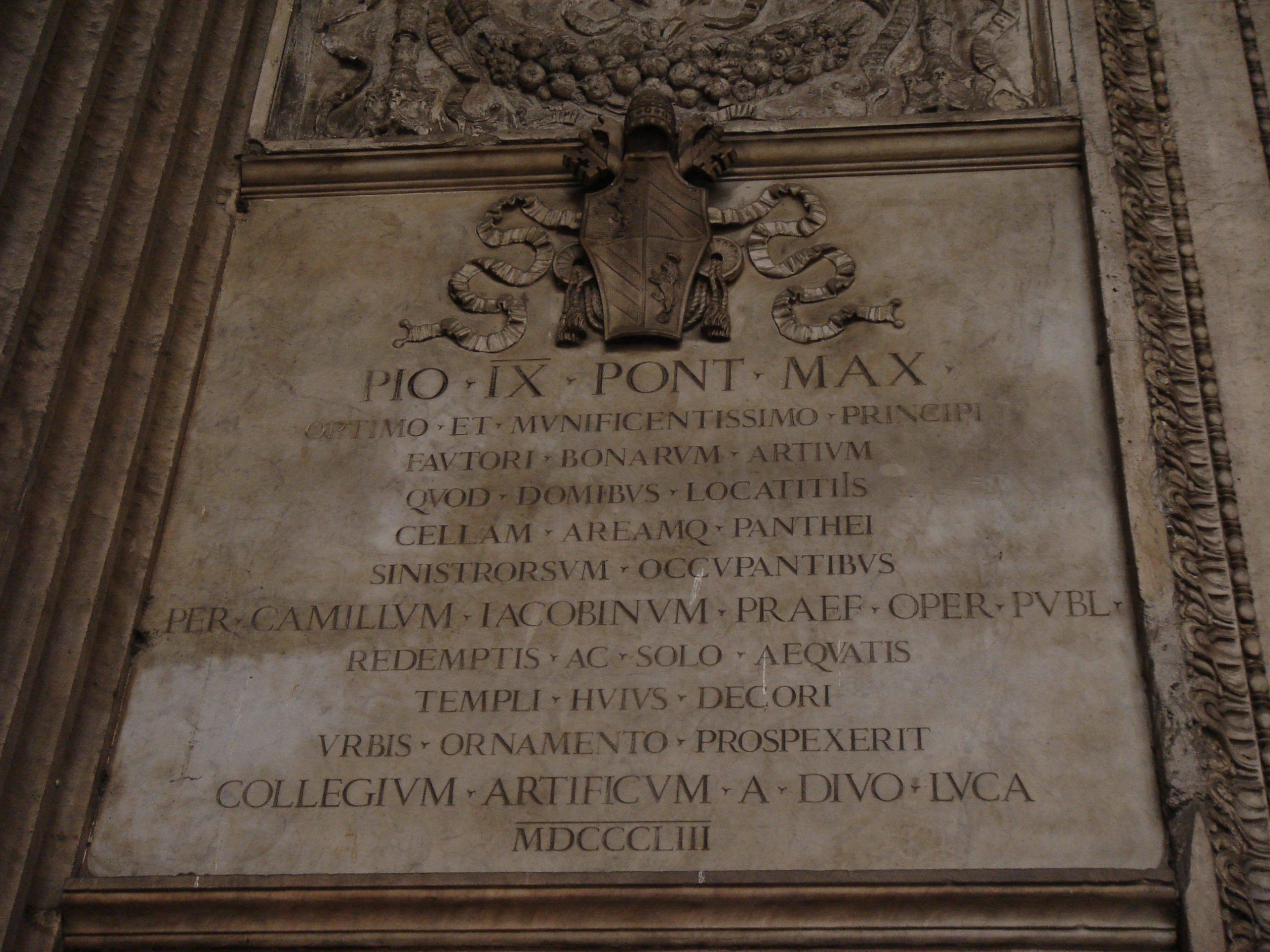 Latin inscription commemorating Pope Pius IX inside the Pantheon, praising his restoration work.